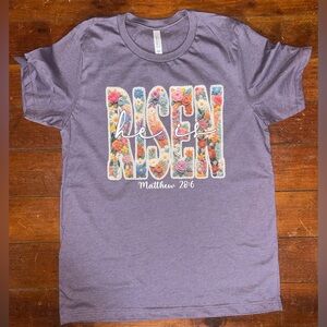 NWOT Women’s 'He is Risen' Floral Graphic Tee - Purple Bella+Canvas L
